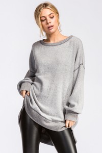 Loose fit, round neck, long sleeve hi-low tunic top. Drop shoulder. Has ...